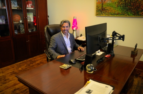 Jon Koucky, Founder and CEO of Net-Vendor, at his desk in the Joplin MO office